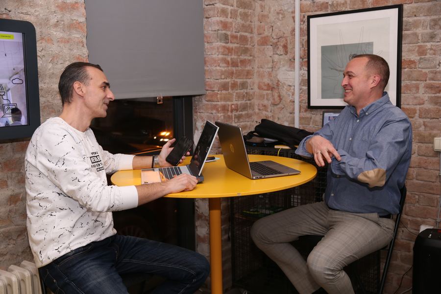 A quick sync over laptops at the office cafe table